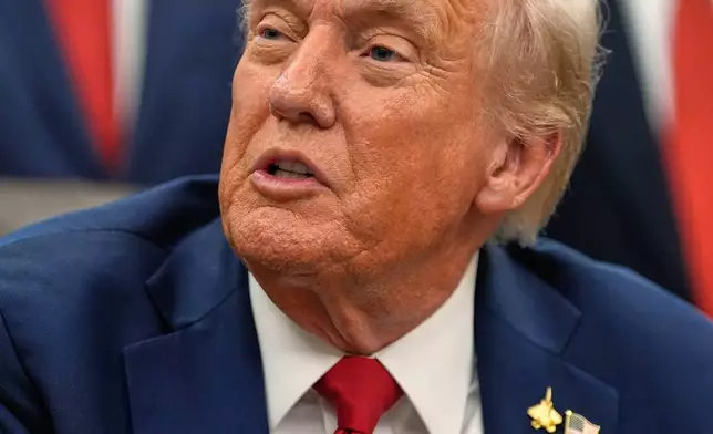President Donald Trump speaks in the Oval Office of the White House before signing an executive order regarding childhood cancer and the use of AI, Tuesday, Sept. 30, 2025, in Washington. (AP Photo/Alex Brandon)