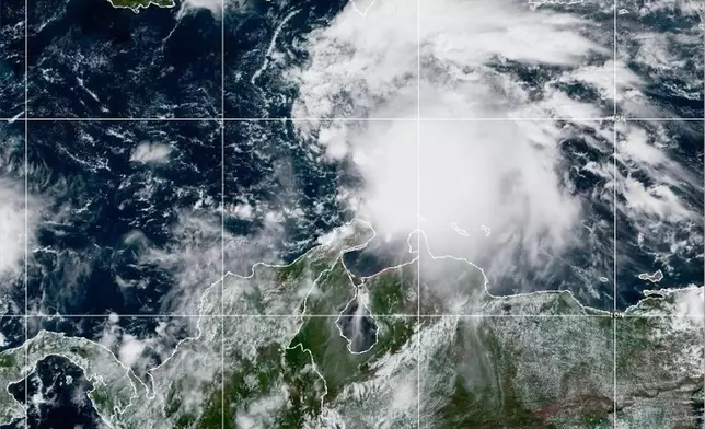 This NOAA satellite image taken at 11:40 a.m. EST on Tuesday, Oct. 21, 2025, shows Tropical Storm Melissa in the Central Caribbean Sea. (NOAA via AP)