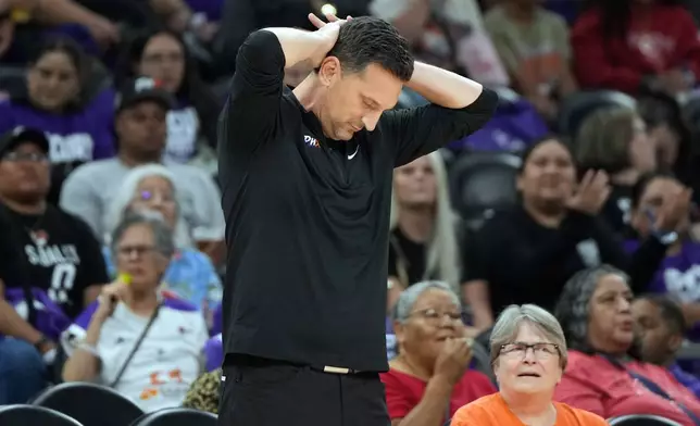 Phoenix Mercury head coach Nate Tibbetts reacts after a call against the Las Vegas Aces during the second half of Game 4 of the WNBA basketball finals, Friday, Oct. 10, 2025, in Phoenix. (AP Photo/Rick Scuteri)