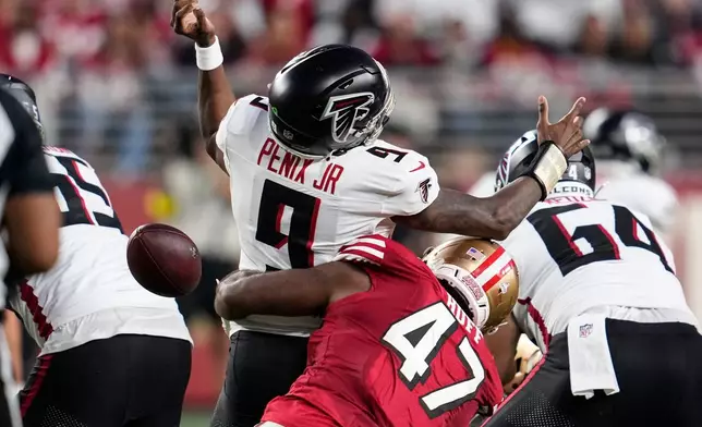 San Francisco 49ers defensive end Bryce Huff (47) forces a fumble against Atlanta Falcons quarterback Michael Penix Jr. (9) in the first half of an NFL football game, Sunday, Oct. 19, 2025, in Santa Clara, Calif. (AP Photo/Godofredo A. Vásquez)