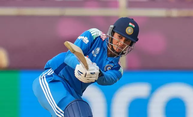 India's Smriti Mandhana plays a shot during the ICC Women's Cricket World Cup match between India and Australia at ACA-VDCA Cricket Stadium in Visakhapatnam, India, Sunday, Oct. 12, 2025. (AP Photo/Aijaz Rahi)