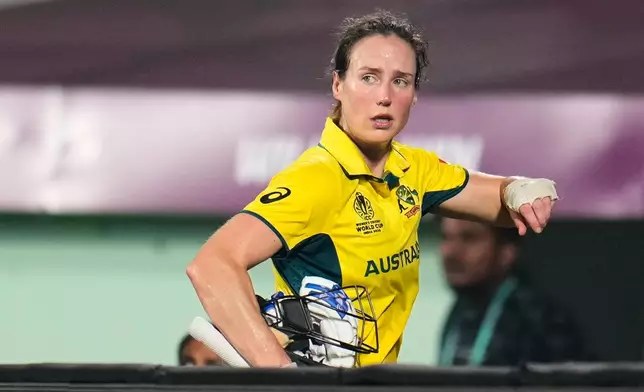 Australia's Ellyse Perry leaves the field retired hurt during the ICC Women's Cricket World Cup match between India and Australia at ACA–VDCA Cricket Stadium in Visakhapatnam, India, Sunday, Oct. 12, 2025. (AP Photo/Aijaz Rahi)