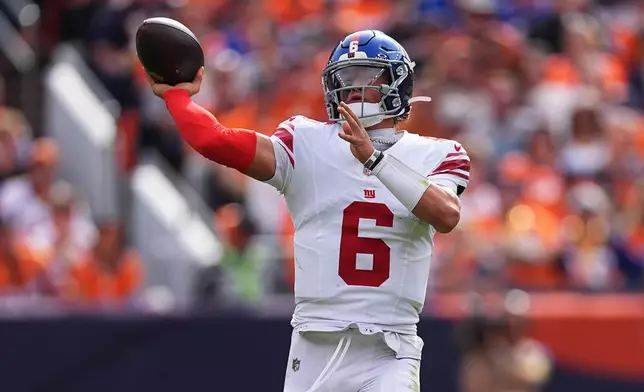 New York Giants quarterback Jaxson Dart (6) passes against the Denver Broncos during the first half of an NFL football game in Denver, Sunday, Oct. 19, 2025. (AP Photo/David Zalubowski)