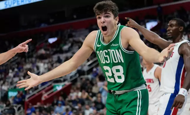 Boston Celtics guard Hugo Gonzalez (28) reacts during the first half of an NBA basketball game against the Detroit Pistons, Sunday, Oct. 26, 2025, in Detroit. (AP Photo/Ryan Sun)
