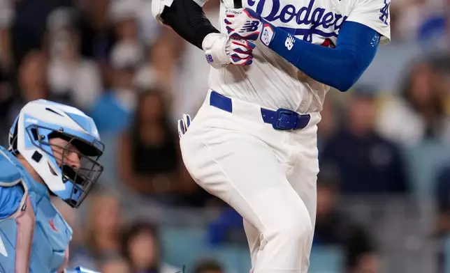 Los Angeles Dodgers' Shohei Ohtani lines out during the eighth inning in Game 5 of baseball's World Series against the Toronto Blue Jays, Wednesday, Oct. 29, 2025, in Los Angeles. (AP Photo/Ashley Landis)