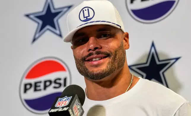 Dallas Cowboys' Dak Prescott talks after an NFL football game against the New York Jets Sunday, Oct. 5, 2025, in East Rutherford, N.J. (AP Photo/Seth Wenig)