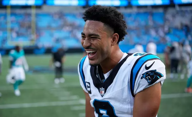 Carolina Panthers quarterback Bryce Young celebrates after their win against the Miami Dolphins in an NFL football game, Sunday, Oct. 5, 2025, in Charlotte, N.C. (AP Photo/Jacob Kupferman)