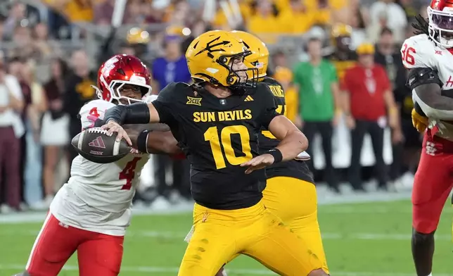 Arizona State quarterback Sam Leavitt throws against Houston during the first half of an NCAA college football game Saturday, Oct. 25, 2025, in Tempe, Ariz. (AP Photo/Ross D. Franklin)
