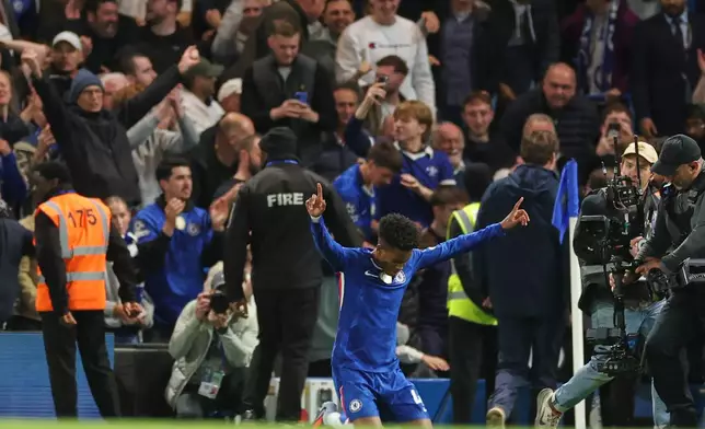 Chelsea's Estevao celebrates after scoring his side's second goal during the English Premier League soccer match between Chelsea and Liverpool at Stamford Bridge in London, Saturday, Oct. 4, 2025. (AP Photo/Ian Walton)