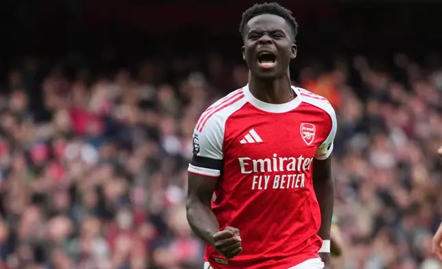 CORRECTS THE NUMBER OF A GOAL - Arsenal's Bukayo Saka celebrates after scoring his side's second goal during the English Premier League soccer match between Arsenal and West Ham United at the Emirates stadium in London, Saturday, Oct. 4, 2025. (AP Photo/Kirsty Wigglesworth)