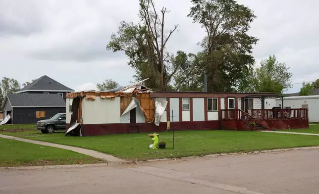 A home's exterior is damaged on June 25, 2025 following an EF5 tornado in Enderlin, N.D. (North Dakota Governor's Office via AP)