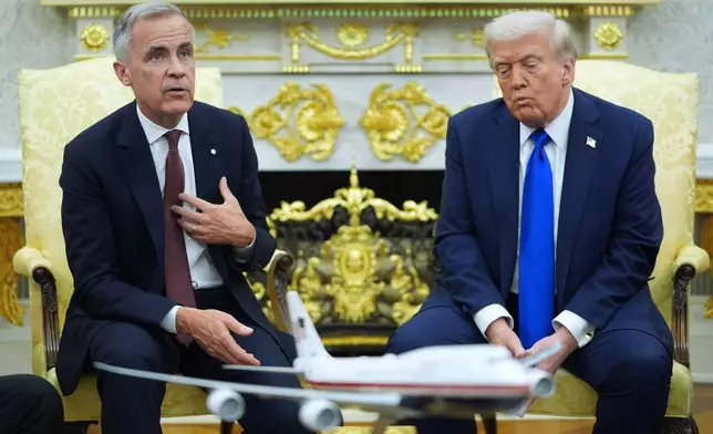 President Donald Trump and Canadian Prime Minister Mark Carney meet in the Oval Office of the White House, Tuesday, Oct. 7, 2025, in Washington. (AP Photo/Evan Vucci)
