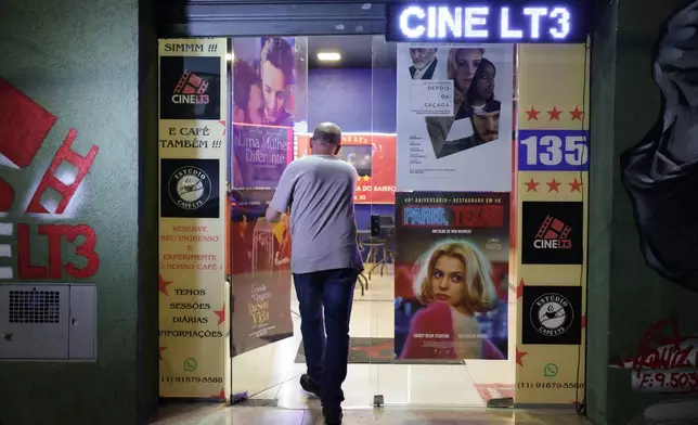 Carlos Costa enters his Cine LT3, built in an old parking garage in Sao Paulo, Thursday, Oct. 9, 2025. (AP Photo/Ettore Chiereguini)