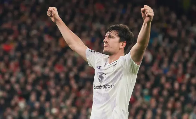 Manchester United's Harry Maguire celebrates after scoring his side's second goal during the English Premier League soccer match between Liverpool and Manchester United in Liverpool, England, Sunday, Oct. 19, 2025. (AP Photo/Ian Hodgson)
