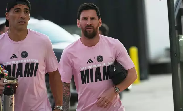 InterMiami's Luis Suarez and Lionel Messi arrive at the MLS playoff opening round soccer match against the Nashville SC Friday October 24, 2025 in Fort Lauderdale, Fla. (AP Photo/Marta Lavandier)