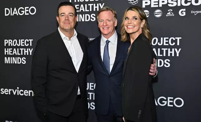 Carson Daly, left, Roger Goodell and Savannah Guthrie attend the third annual World Mental Health Day Gala, hosted by Project Healthy Minds, at Spring Studios on Thursday, Oct. 9, 2025, in New York. (Photo by Evan Agostini/Invision/AP)