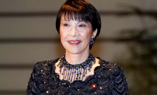 FILE - Sanae Takaichi, newly appointed Internal Affairs and Communications minister, enters the prime minister's official residence in Tokyo Wednesday, Sept. 11, 2019. (AP Photo/Eugene Hoshiko, File)