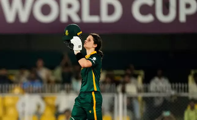 South Africa's captain Laura Wolvaardt celebrates her century during the ICC Women's Cricket World Cup first semifinal match between England and South Africa at Barsapara Cricket Stadium in Guwahati, India, Thursday, Oct. 29, 2025. (AP Photo/Anupam Nath)