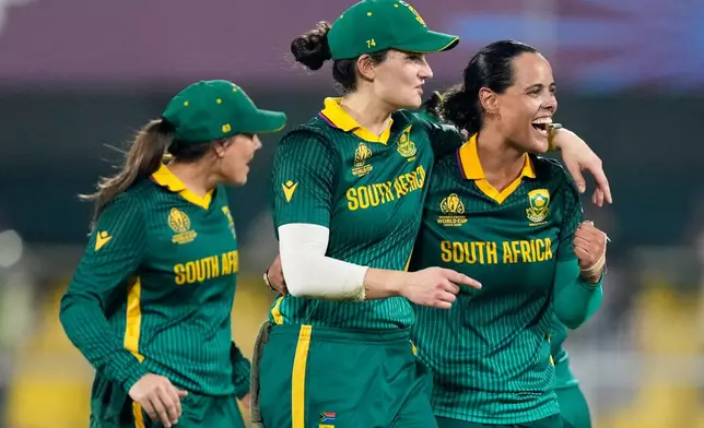 South Africa's players celebrate after winning the ICC Women's Cricket World Cup first semifinal match between England and South Africa at Barsapara Cricket Stadium in Guwahati, India, Thursday, Oct. 29, 2025. (AP Photo/Anupam Nath)