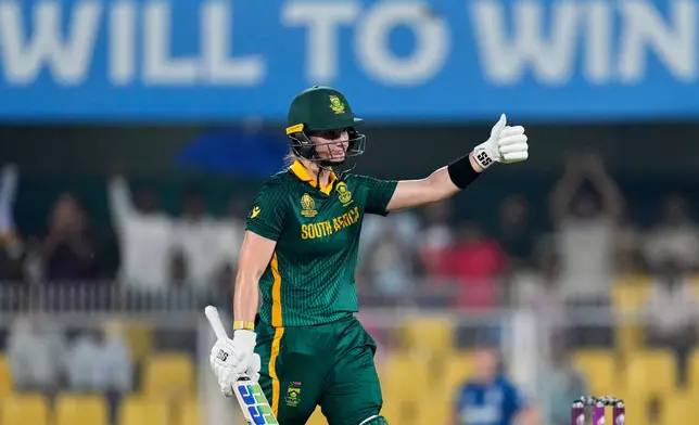South Africa's captain Laura Wolvaardt celebrates one hundred and fifty runs during the ICC Women's Cricket World Cup first semifinal match between England and South Africa at Barsapara Cricket Stadium in Guwahati, India, Thursday, Oct. 29, 2025. (AP Photo/Anupam Nath)