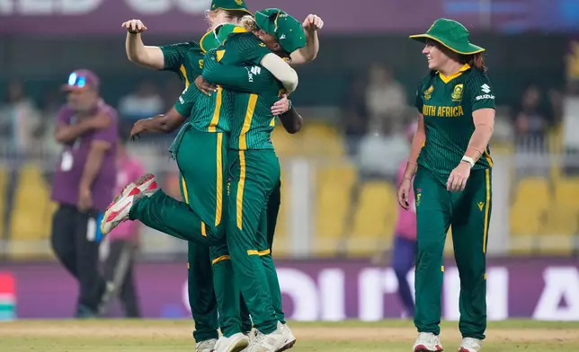 South Africa's players celebrate after winning the ICC Women's Cricket World Cup first semifinal match between England and South Africa at Barsapara Cricket Stadium in Guwahati, India, Thursday, Oct. 29, 2025. (AP Photo/Anupam Nath)