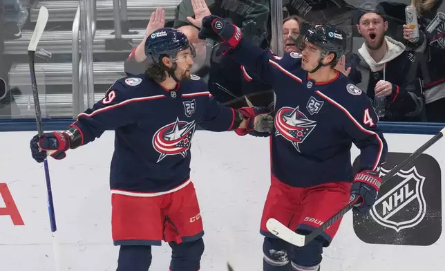Columbus Blue Jackets center Cole Sillinger (4) celebrates his goal with defenseman Ivan Provorov (9) in the first period of an NHL hockey game against the Toronto Maple Leafs in Columbus, Wednesday, Oct. 29, 2025. (AP Photo/Sue Ogrocki)