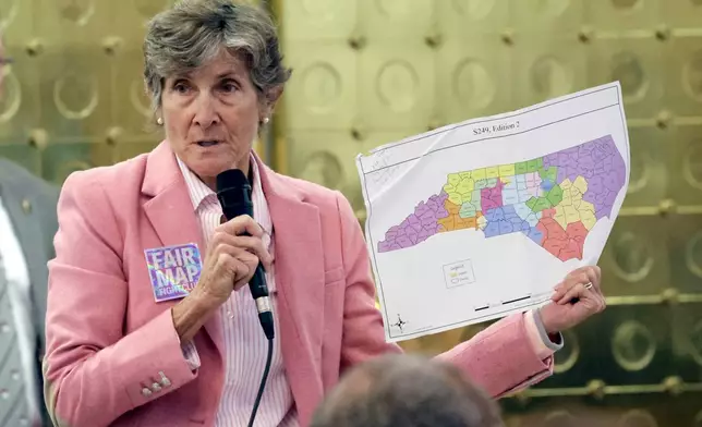 Rep. Pricey Harreison, D-Guilford, holds an alternative map as she speaks on a redistricting bill at the Legislative Building, Wednesday, Oct. 22, 2025, in Raleigh, N.C. (AP Photo/Chris Seward)