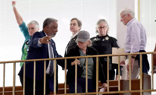 Security clears the gallery after an outburst during a redistricting bill debate at the Legislative Building, Wednesday, Oct. 22, 2025, in Raleigh, N.C. (AP Photo/Chris Seward)