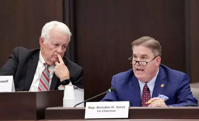 House Redistricting Committee Co-Chairs Rep. Hugh Blackwell, R- Burke, left, listens as Rep. Brenden Jones, R-Columbus, right, speaks during a committee meeting regarding a proposed redistricting map Tuesday, Oct. 21, 2025, in Raleigh, N.C. (AP Photo/Chris Seward)