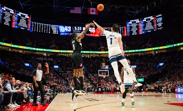 Portland Trail Blazers forward Jerami Grant (9) shoots a three-pointer past Minnesota Timberwolves guard/forward Terrence Shannon Jr. (1) during the first half of an NBA basketball game on Wednesday, Oct. 22, 2025, in Portland, Ore. (AP Photo/Molly J. Smith)