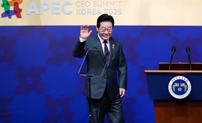 South Korean President Lee Jae Myung waves as he takes the stage at the Asia-Pacific Economic Cooperation (APEC) CEO summit in Gyeongju, South Korea, Wednesday, Oct. 29, 2025. (AP Photo/Ng Han Guan)