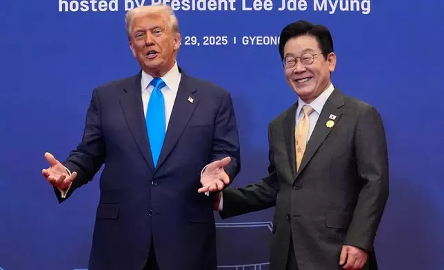 President Donald Trump poses for a photo with South Korean President Lee Jae Myung during a dinner event in Gyeongju, South Korea, Wednesday, Oct. 29, 2025. (AP Photo/Mark Schiefelbein)