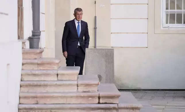 Chairman of opposition "ANO" (YES) movement Andrej Babis arrives to presidential office, a day after he got majority of votes at the parliamentary elections, in Prague, Czech Republic, Sunday, Oct. 5, 2025. (AP Photo/Darko Bandic)
