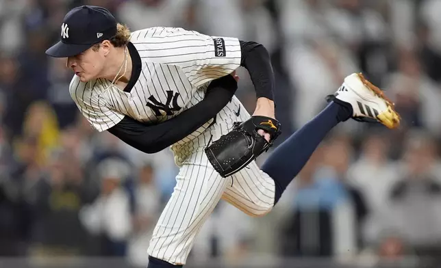 New York Yankees pitcher Cam Schlittler delivers against the Boston Red Sox during the seventh inning of Game 3 of an American League wild-card baseball playoff series, Thursday, Oct. 2, 2025, in New York. (AP Photo/Frank Franklin II)