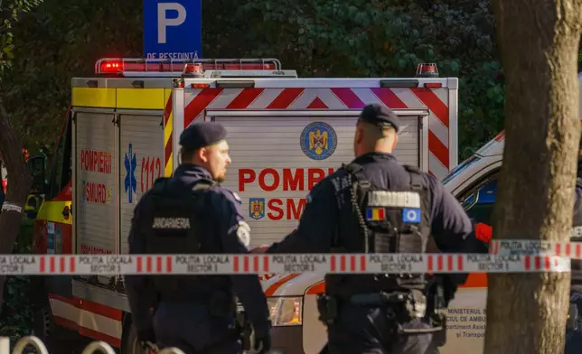 Romanian gendarmerie cordon off a street in front of a damaged apartment building after a powerful explosion in a residential block in Bucharest, Romania, Friday, Oct. 17, 2025. (AP Photo)