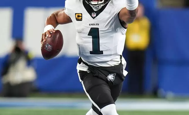 Philadelphia Eagles' Jalen Hurts plays during the first half of an NFL football game against the New York GiantsThursday, Oct. 9, 2025, in East Rutherford, N.J. (AP Photo/Seth Wenig)