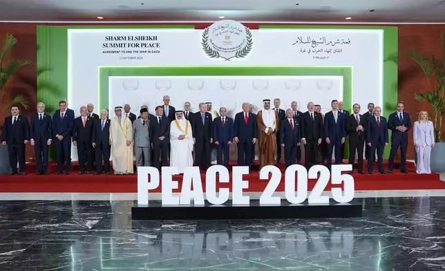 President Donald Trump and other world leaders pose for a photo during a summit to support ending the more than two-year Israel-Hamas war in Gaza after a breakthrough ceasefire deal, Monday, Oct. 13, 2025, in Sharm El Sheikh, Egypt. (AP Photo/Evan Vucci, Pool)