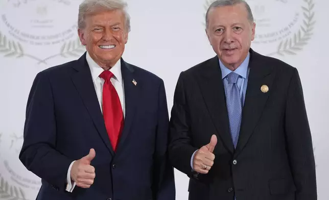 President Donald Trump greets Turkey's President Recep Tayyip Erdogan during a summit to support ending the more than two-year Israel-Hamas war in Gaza after a breakthrough ceasefire deal, Monday, Oct. 13, 2025, in Sharm El Sheikh, Egypt. (AP Photo/Evan Vucci, Pool)