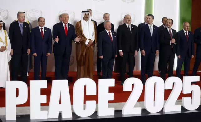 From the left, Turkish President Recep Tayyip Erdogan, Egyptian President Abdel Fattah al-Sisi, US President Donald Trump, Emir of Qatar Cheikh Tamim ben Hamad al-Thani, King Abdullah II of Jordan, and fellow dignitaries pose during the family picture at the Gaza International Peace Summit, in Sharm el-Sheikh, Egypt, Monday, Oct.13 2025. (Yoan Valat, Pool photo via AP)
