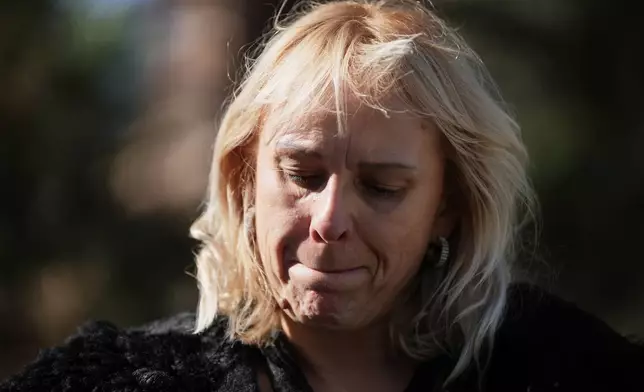 Diana Hrka, the mother of Stefan Hrka, a young man who died when the canopy of the railway station in Novi Sad fell reacts during an interview with The Associated Press, in Belgrade, Serbia, Tuesday, Oct. 14, 2025. (AP Photo/Darko Vojinovic)