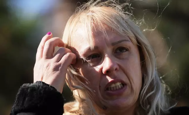 Diana Hrka, the mother of Stefan Hrka, a young man who died when the canopy of the railway station in Novi Sad fell reacts during an interview with The Associated Press, in Belgrade, Serbia, Tuesday, Oct. 14, 2025. (AP Photo/Darko Vojinovic)