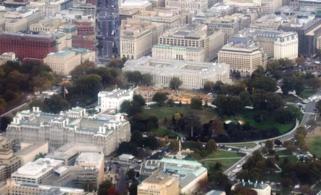 Debris cleanup from the East Wing of the White House and construction of the new ballroom continues, as photographed through an airplane window, Friday, Oct. 24, 2025, in Washington. (AP Photo/Alex Brandon)