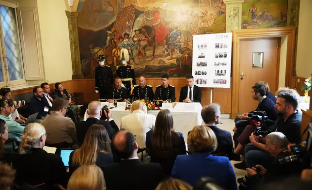 From left, Captain Lorenz Keusch, Colonel Christoph Graf, Lieutenant Colonel Loic Marc Rossier, and Vice-Corporal Eliah Cinotti attend a press conference on the occasion of the presentation of the Swiss Guard Mezza-Gala uniform in the Swiss Guard Barracks at the Vatican, Thursday, Oct. 2, 2025. (AP Photo/Alessandra Tarantino)