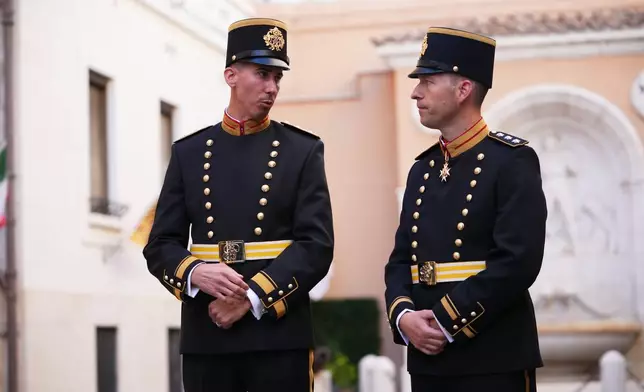 Lieutenant Colonel Loic Marc Rossier, left, and Captain Lorenz Keusch pose for reporters as they present the Swiss Guard Mezza-Gala uniform in the Swiss Guard Barracks at the Vatican, Thursday, Oct. 2, 2025. (AP Photo/Alessandra Tarantino)