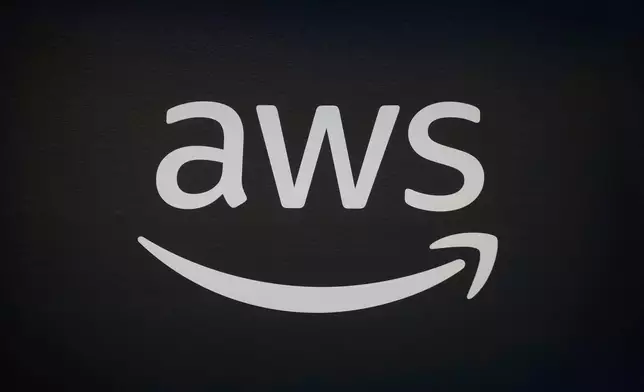 FILE - An AWS, Amazon Web Services, logo is displayed at LlamaCon 2025, an AI developer conference, in Menlo Park, Calif., Tuesday, April 29, 2025. (AP Photo/Jeff Chiu, File)