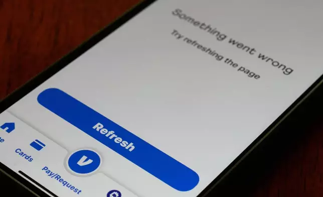 A Venmo mobile app shows it is not available during the Amazon Web Services outage, Monday, Oct. 20, 2025, in Chicago. (AP Photo/Kiichiro Sato)