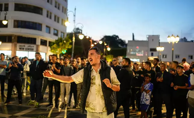 People take part in a youth led protest calling for education and healthcare reforms, in Tangier, Morocco, Saturday, Oct. 18, 2025. (AP Photo/Mosa'ab Elshamy)