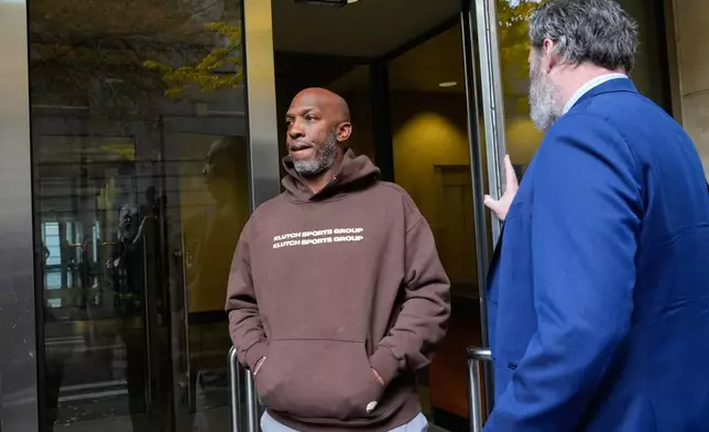 Portland Trail Blazers head coach Chauncey Billups walks to a vehicle after his federal court appearance on Thursday, Oct. 23, 2025, in Portland, Ore. (AP Photo/Jenny Kane)