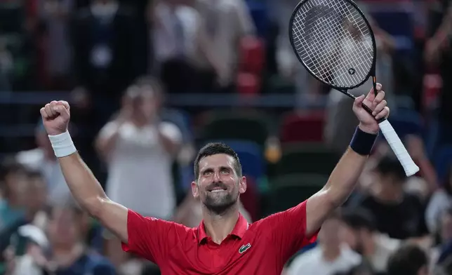 Novak Djokovic, of Serbia celebrates after defeating Jaume Munar, of Spain in the men's singles match of the Shanghai Masters tennis tournament at Qizhong Forest Sports City Tennis Center, in Shanghai, China, Tuesday, Oct. 7, 2025. (AP Photo/Andy Wong)