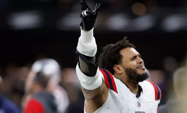 New England Patriots defensive tackle Jaquelin Roy reacts after New Orleans Saints tight end Juwan Johnson fumbled the ball during the second half of an NFL football game, Sunday, Oct. 12, 2025, in New Orleans. (AP Photo/Butch Dill)